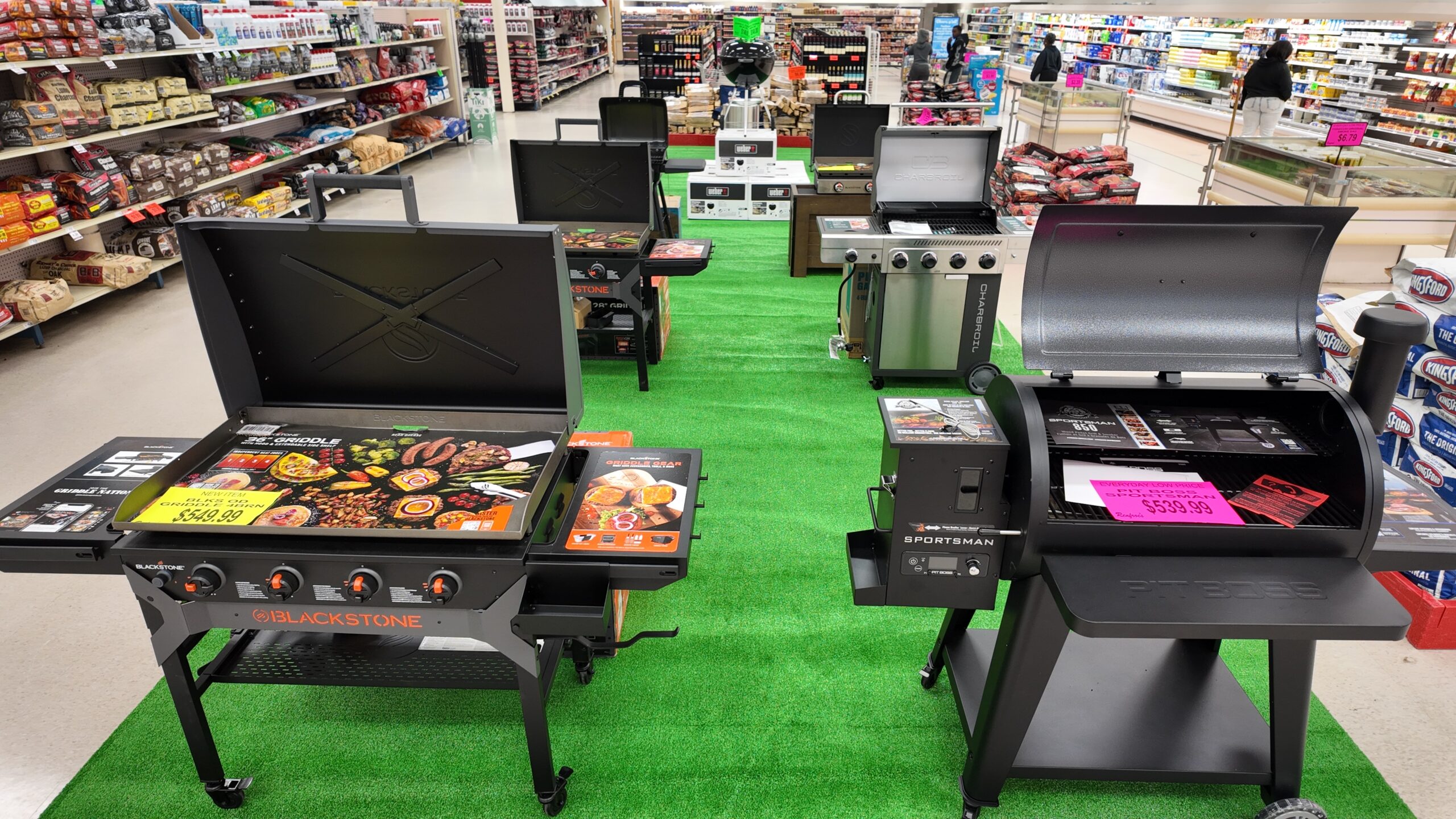 Blackstone, Pit Boss, Weber, and Charbroil grills on the sales floor at Renfroe's