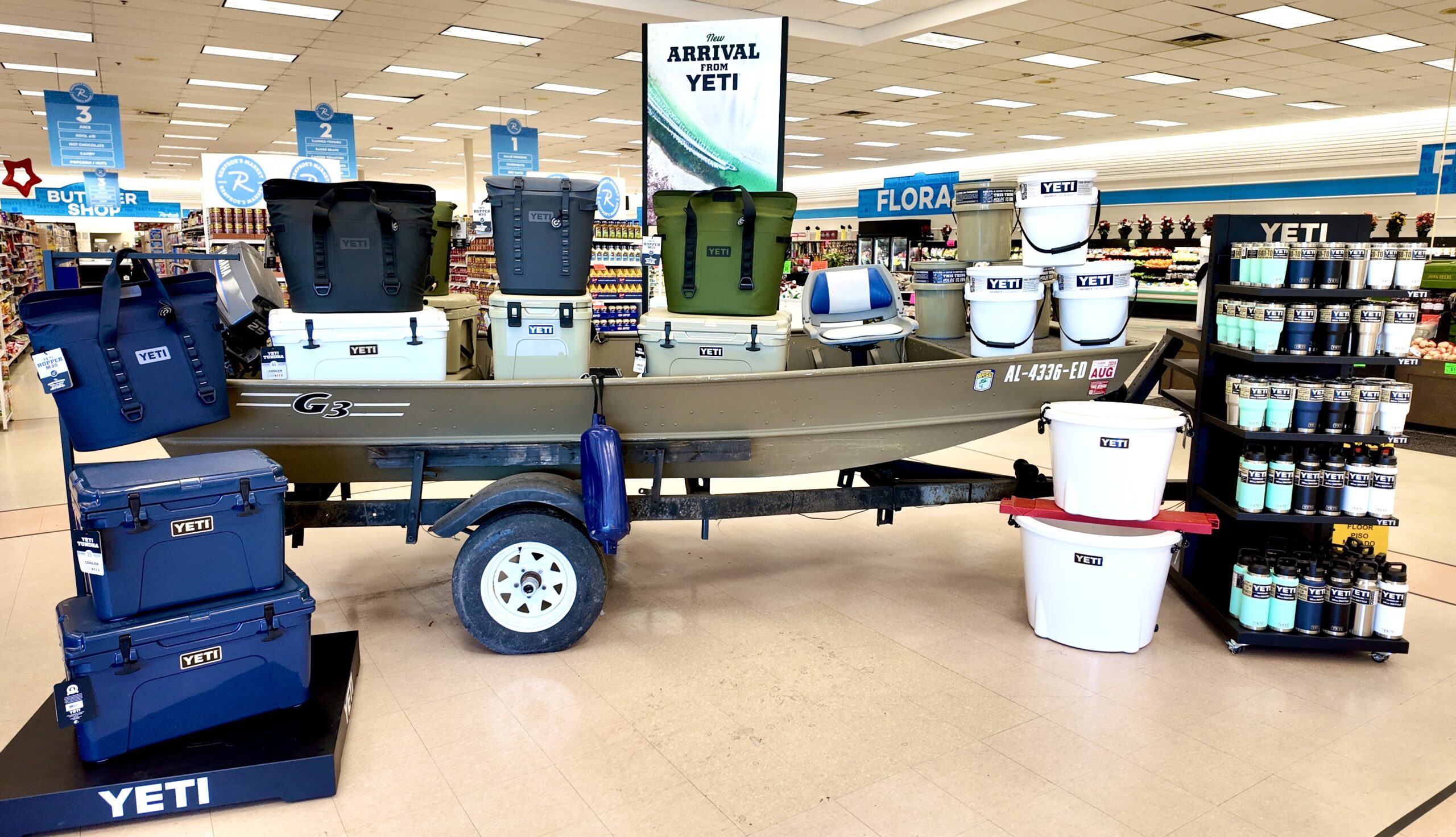 Yeti Tundra, Roadie, Hopper soft coolers, buckets and drinkware displayed on a G3 jon boat at Renfroe's