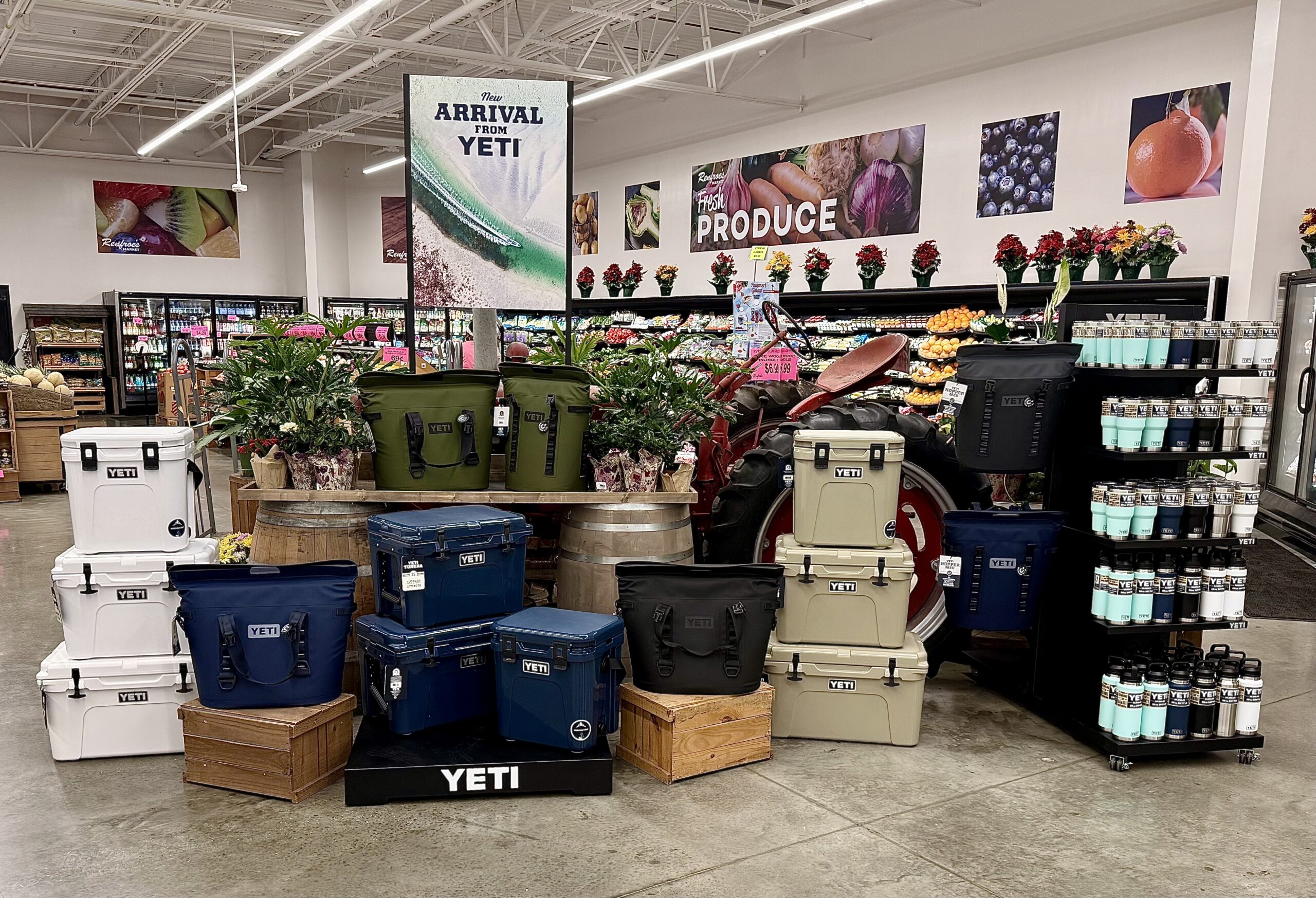Yeti boat display at Renfroe's Market — featuring a G3 jon boat loaded with Yeti soft coolers and Hopper bags